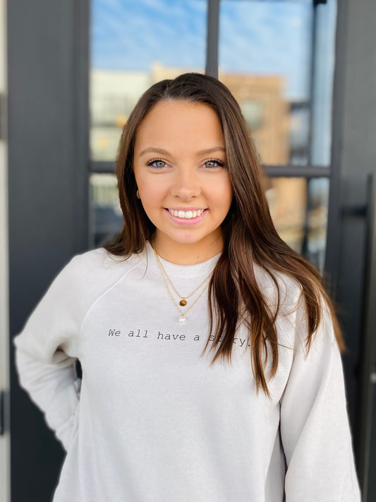 ‘We all have a story’ Sweatshirt